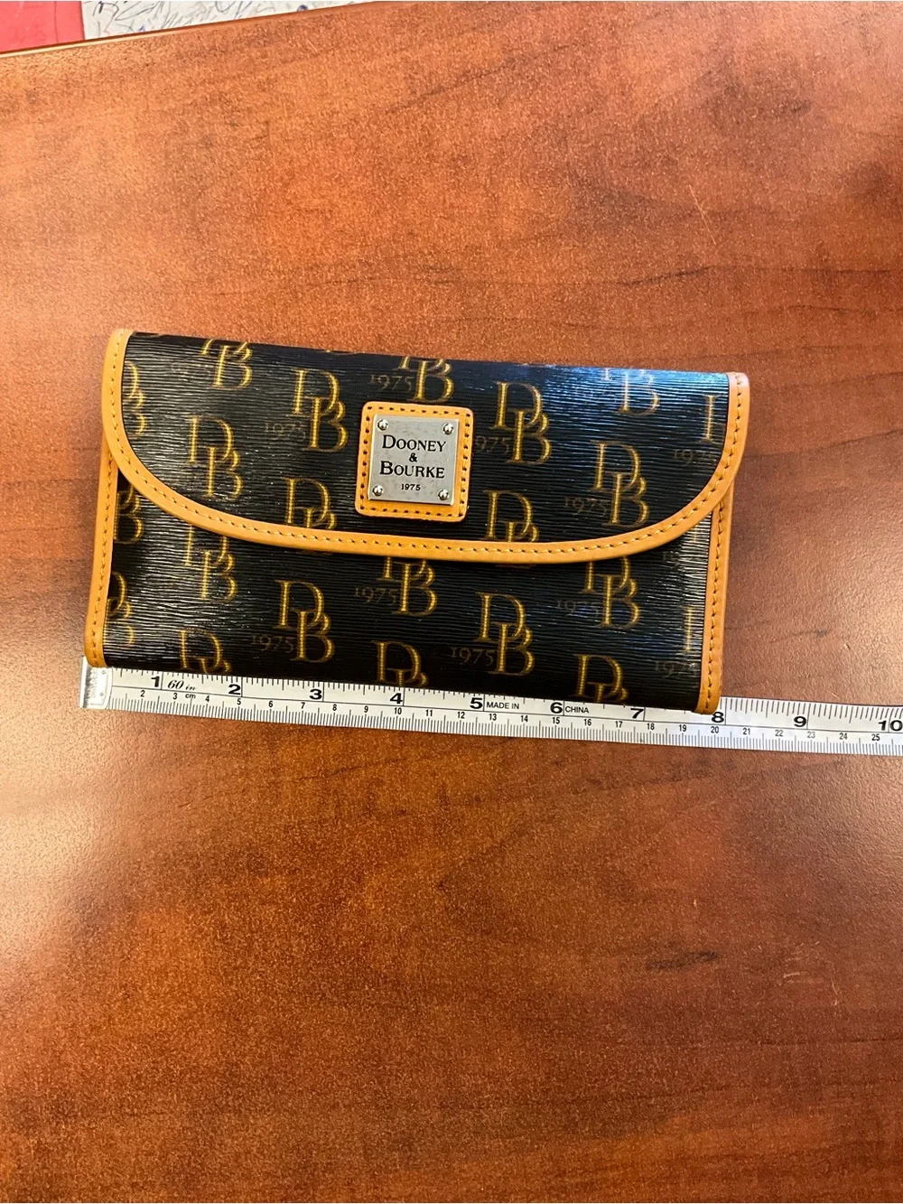 Dooney & Bourke Black Wallet with Yellow Trim and Logo Plaque